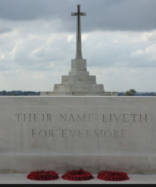 A Commonwealth War Graves Commission Cross of Sacrifice with wreaths
